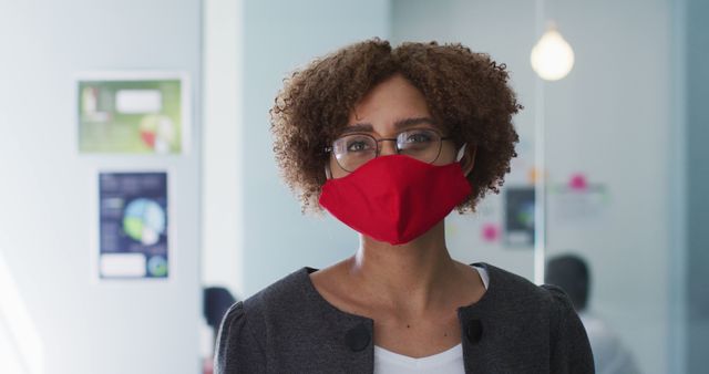 Professional Woman Wearing Red Face Mask in Office Environment - Download Free Stock Images Pikwizard.com