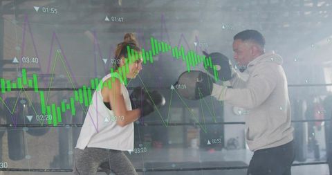 Boxer Training With Coach Holding Focus Mitts, Sports Performance Data Overlay
