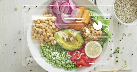 Presenting vibrant bowl with avocado chickpeas peas lemon and digital nutrition hud overlay