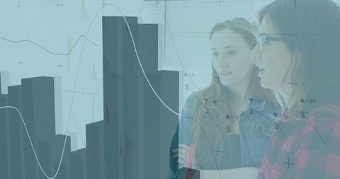 Business Team Analyzing Graphical Data on Office Wall