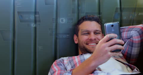 Young Man Comfortably Using Smartphone with Digital Interface