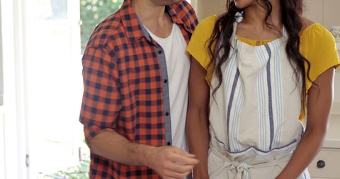 Couple Cooking Together in Home Kitchen Preparing Meal
