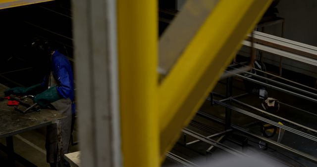 Metalworker in Protective Gear Operating in Industrial Warehouse - Download Free Stock Images Pikwizard.com