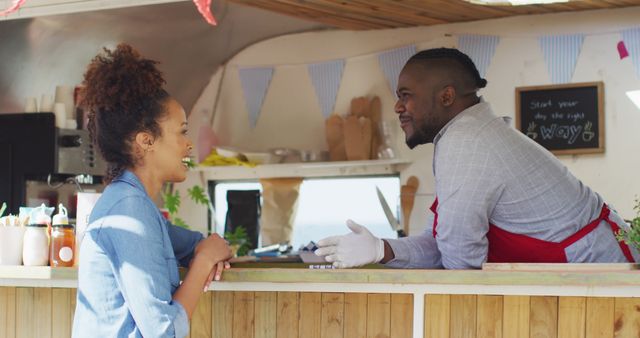 Customers chatting with food truck vendor in friendly setting - Download Free Stock Images Pikwizard.com