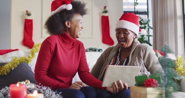 Smiling Family Celebrating Christmas with Digital Tablet on Couch - Download Free Stock Images Pikwizard.com