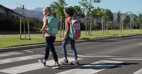 Diverse Schoolgirls Crossing Road for Safe Journey to School on Sunny Day - Download Free Stock Images Pikwizard.com
