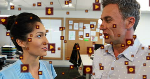 Colleagues Discussing in Digitally Connected Office