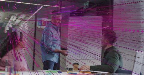 Creative brainstorming session with magenta digital overlay in modern office