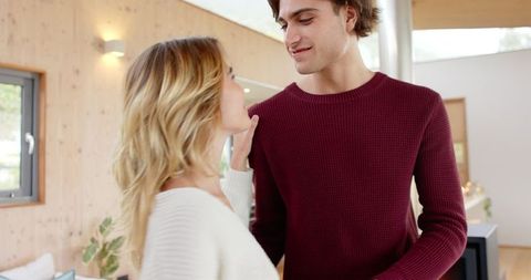 Tender Moment Between Female Partners in Cozy Living Room