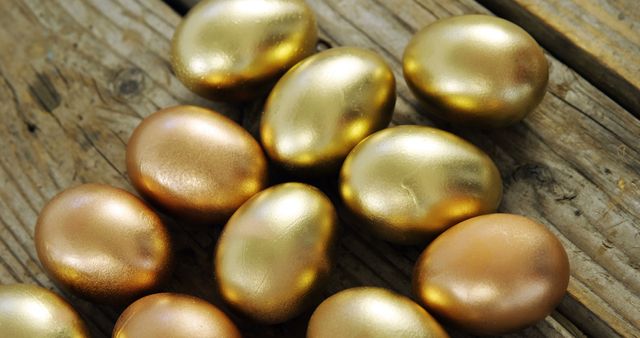 Gold and Bronze Egg Arrangement on Wooden Surface - Download Free Stock Images Pikwizard.com