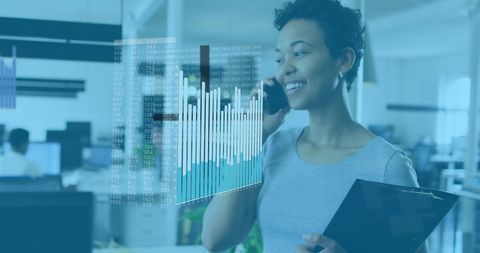 Professional Woman in Modern Office Analyzing Data on Phone