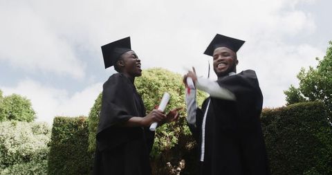 Joyful Graduates Celebrating Success by Tossing Caps