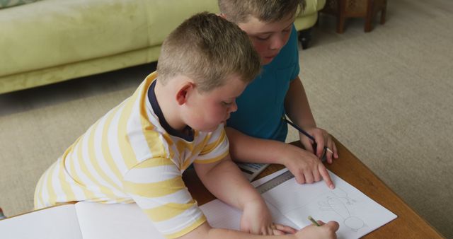 Brothers Doing Homework Together at Home - Download Free Stock Images Pikwizard.com