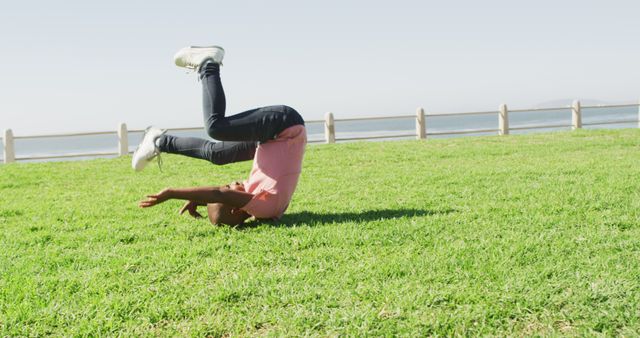 Child Practicing Gymnastics Outside on Sunny Day - Download Free Stock Images Pikwizard.com