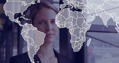 Businesswoman Overlooking Skyline with World Map Overlay