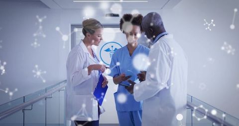 Medical team discussing patient data in hospital corridor with digital network overlay