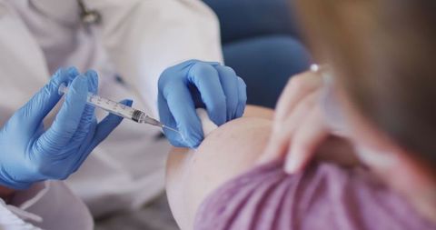 Doctor in Action Giving Vaccine Shot to Patient in Clinical Setting - Download Free Stock Images Pikwizard.com