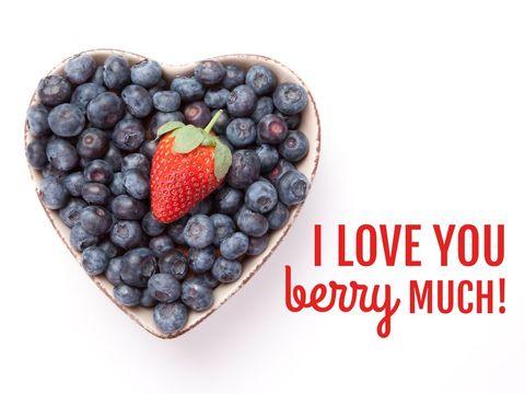 Heart bowl of blueberries with strawberry for sweet love message