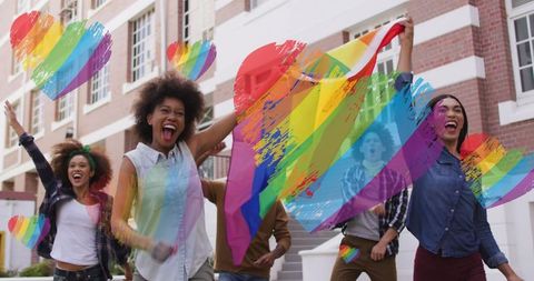 Diverse Group Celebrating with LGBTQ Flags at Pride Event