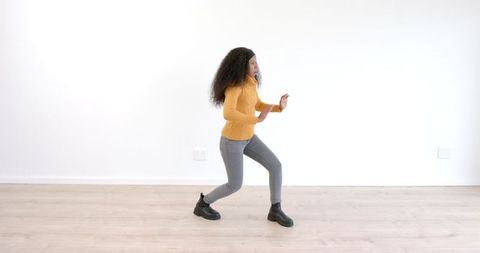 Woman Practicing Dance Steps in Bright Studio