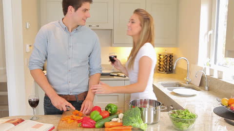 Couple Cooking Together and Sharing a Moment in Modern Kitchen