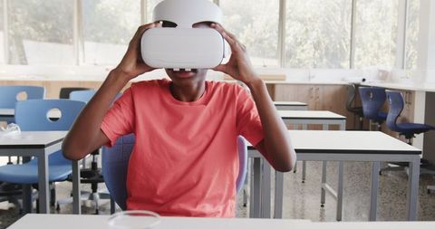 Boy Experiencing Virtual Reality in Educational Setting
