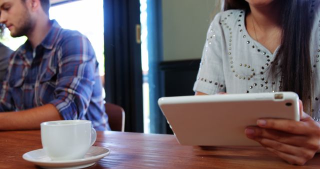 Young People Using Gadgets in Cozy Cafe Environment - Download Free Stock Images Pikwizard.com