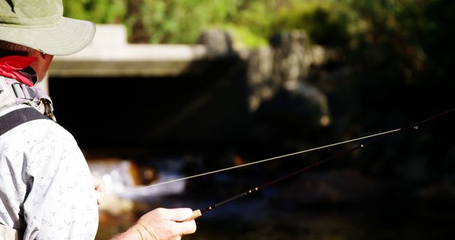 Fisherman Fly Fishing in Sunny Outdoor Stream - Download Free Stock Images Pikwizard.com