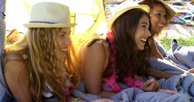 Hipster women laughing in a festival
