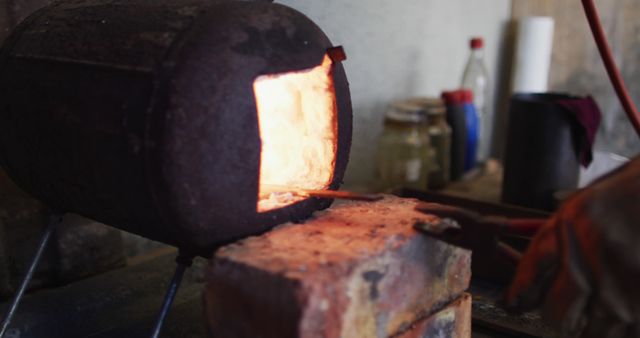 Metalworker Using Furnace for Metal Shaping - Download Free Stock Images Pikwizard.com