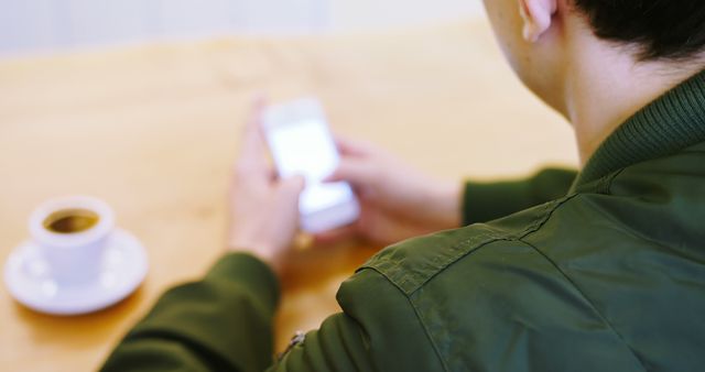 Person Using Smartphone in Cafe with Coffee - Download Free Stock Images Pikwizard.com