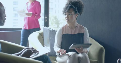 Diverse Business Team Collaborating Over Financial Strategy