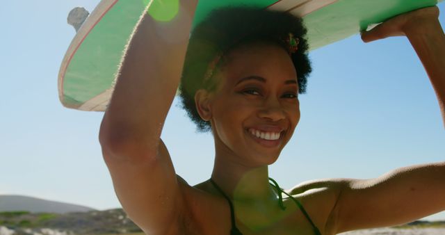 Happy Woman Carrying Surfboard at Sunny Beach - Download Free Stock Images Pikwizard.com