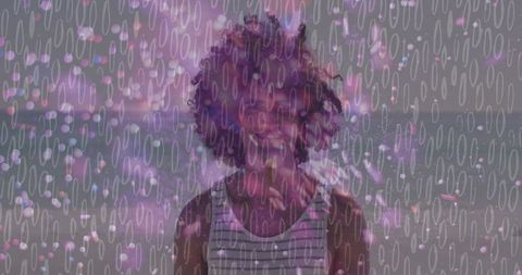 Smiling man on beach with purple bokeh overlay and sheer oval pattern double exposure portrait