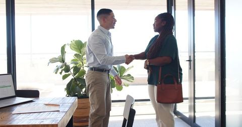 Positive Business Meeting in Modern Office with Diverse Professionals