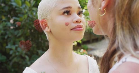 Diverse Couple Magical Moment with Heart Overlay Outdoors