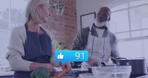 Joyful Senior Couple Cooking with Social Media Interaction