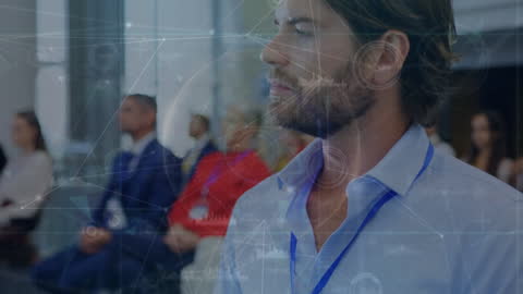 Businessman Analyzing Digital Data at Network Conference