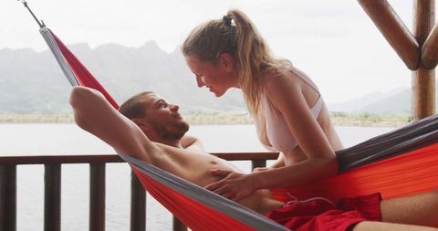 Romantic Couple Relaxing in Hammock by Lake - Download Free Stock Images Pikwizard.com