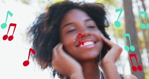 Joyful Woman Listening to Music Outdoors