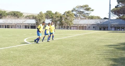Soccer players in training drills on field in uniform
