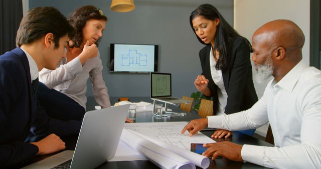 Architect Team Collaborating on Project Designs in Office - Download Free Stock Images Pikwizard.com