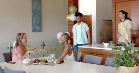 Friends Enjoying Togetherness During Home Celebration