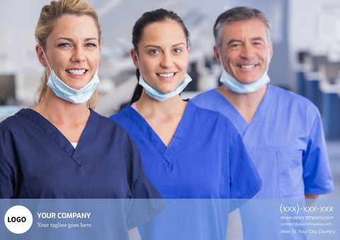 Healthcare professionals in scrubs smiling in hospital