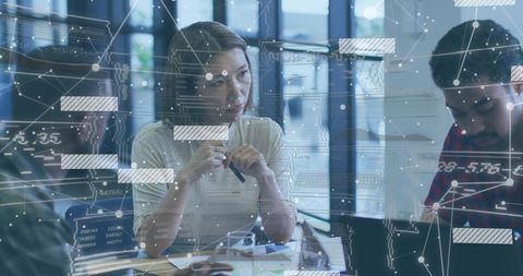 Female leader guiding analytics collaboration meeting with laptop, data visualization and documents