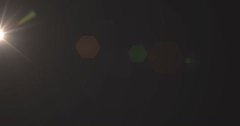 Bright light flare in dark space with lens effects