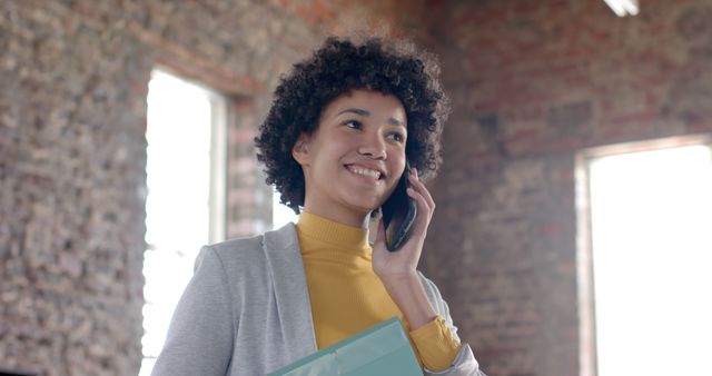 Confident Young Black Woman Talking on Phone in Office - Download Free Stock Images Pikwizard.com