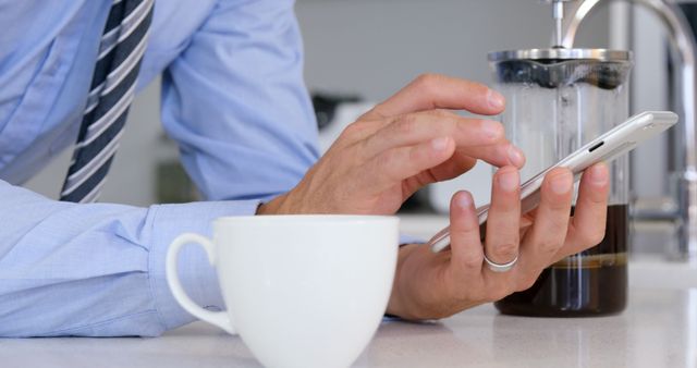 Business Professional using Smartphone with Coffee in Office Kitchen - Download Free Stock Images Pikwizard.com