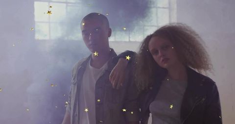 Friends Posing in Misty Loft with Golden Confetti