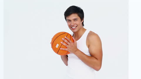 Man Smiling with Basketball on Finger Against White Background